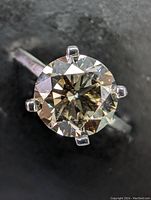 Top-down view showing round brilliant diamond and six-prong setting