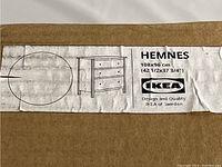 Box label showing IKEA Hemnes dresser model with dimensions 108 x 96 cm (42 1/2 x 37 3/4 inches)