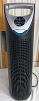 Full front view of Therapure air purifier showing tower design, handle, and ventilation grilles.