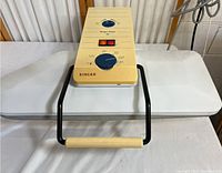 Front view of vintage Singer Magic Press 4 with handle and top panel controls visible.