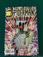 Full front cover of The Amazing Spider-Man #25 comic book showing foil detailing and title.