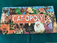Top view of Cat-opoly game box with illustrated cats on the lid.