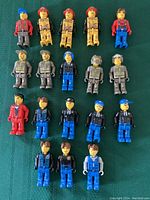 Photo showing all 18 Jack Stone mini figures arranged in rows, various outfits represented.