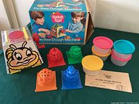 Full set with dough machine, molds, containers, box, and instructions displayed