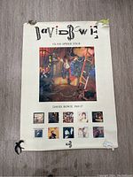 Full view of the David Bowie Glass Spider Tour poster showing the entire layout, damage, and colors.