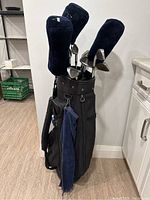 Full view of black Golf Trends bag with clubs and accessories