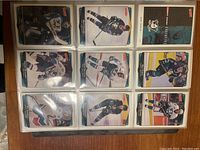 Page 1 showing nine cards including players from Vancouver Canucks and Pittsburgh Penguins