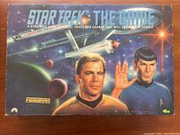 Photo of the original Star Trek: The Game box showing characters and starship artwork