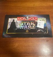 Top view of closed game box with Star Wars Monopoly branding and Darth Vader image on the front.