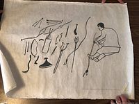 Full view of linocut print laid flat on wood surface