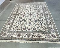 Top-down view of entire rug on concrete floor