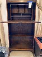 Mid century walnut secretary desk with fold-down panel open showing interior organizational cubbies and shelves, no visible damage