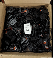 Box filled with many small black cooling fans with wiring for Prusa MK3 3D printers