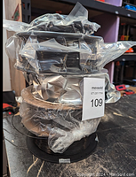 Photo of three spools of 1.75mm diameter 3D printer filament wrapped in plastic indicated as lot 109.