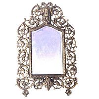 Front view of ornate bronze wall mirror featuring Bacchus head and beveled mirror.