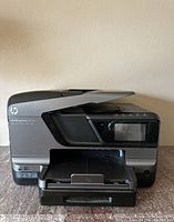 Front view of HP OfficeJet Pro 8600 Plus printer with paper tray extended