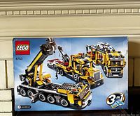 Front of unopened box showing LEGO logo, set number 6753, and primary 3-in-1 transport model