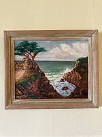 Frontal image of painting showing lone pine tree cliff scene framed