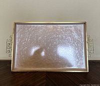 Full top view of the pink moiré glazed rectangular enameled tray showing the gold-tone wire handles and metal rim.