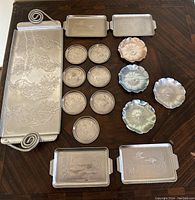 Full view of all aluminum trays and coasters arranged on table