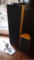 Floorstanding speaker and satellite speaker with remotes and mounting bracket