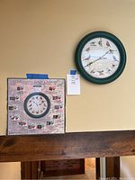 Full view of the Hunter green framed singing bird clock mounted on the wall alongside the bird description and origin poster.