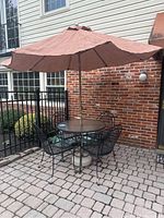 Full view of patio table set with umbrella open