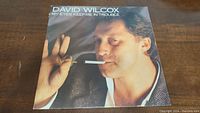 Front cover of vinyl LP with image of David Wilcox and title 'My Eyes Keep Me In Trouble'.