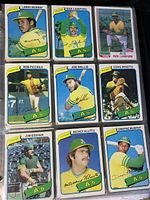 Group of nine Oakland Athletics baseball cards featuring players Larry Murray, Rick Langford (2 cards), Rob Picciolo, Joe Wallis, Craig Minetto, Jim Essian, Mickey Klutts, and Dwayne Murphy in plastic sleeves.