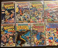 Front covers of 8 comic books showing Marvel and DC titles, including Howard the Duck, Daredevil, Demon, Avengers, and Captain America.