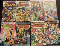 All eight comics laid out in two rows, top four Marvel Avengers, bottom row Atlas and remaining Marvel
