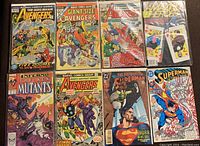 Top view of all 8 comic books arranged in 2 rows of 4 showing all cover art