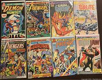 Full lot showing eight comic books from Marvel Comics Group and Atlas Comics on a carpet background.