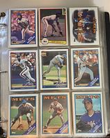 Photo showing nine New York Mets baseball cards arranged in a 3x3 grid inside a plastic sleeve; cards include images and names of players such as Ron Darling, Mike Marshall, Mookie Wilson.