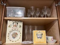 Royal Doulton Bunnykins plate and teacup in box, Brambly Hedge teaset in box, clear glassware, and alphabet children’s bowl.