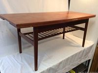 Front right angle showing tabletop surface and slatted lower shelf