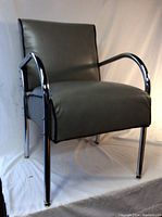 Front-left three-quarter view showing overall chair shape, upholstery and frame