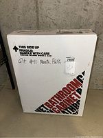 Boxed medicine cabinet with fragile and handle with care warnings, 15x19 inches size indicated.