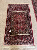 Overview of the two oriental rugs, showing their patterns and relative size