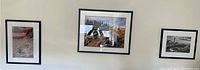 Three framed photographic wall art pieces hung on wall, showing overall lot setup