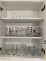 Top shelf with 6 small liqueur glasses in a row