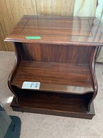 Top and front view of the wooden side table highlighting the smooth tabletop and inner shelf space