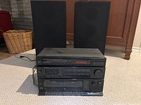 Full stacked set of Kenwood stereo components with two BSM speakers in background