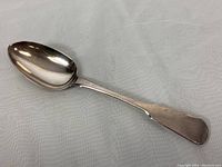 Full view of the 9.25 inch sterling silver serving spoon showing overall shape and condition.