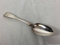 Full view of the 9-inch sterling silver serving spoon showing shape and handle design