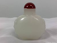Obverse view of white agate bottle with cornelian stopper in place