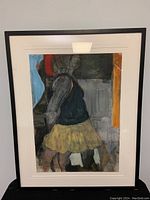 Full front view of framed acrylic painting with white mat showing abstract figure in yellow skirt
