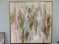 Full view of the framed 36x36 textured abstract print featuring beige, gold, white, gray, and pink tones.