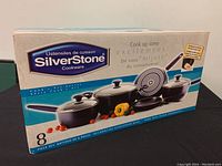 Box front with SilverStone branding and image of cookware set showing two covered saucepans, Dutch oven, and two open frypans.