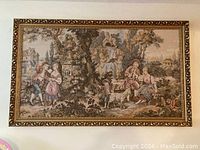 Full frontal view of the large tapestry wall art in gold ornate frame showing complete pastoral scene.